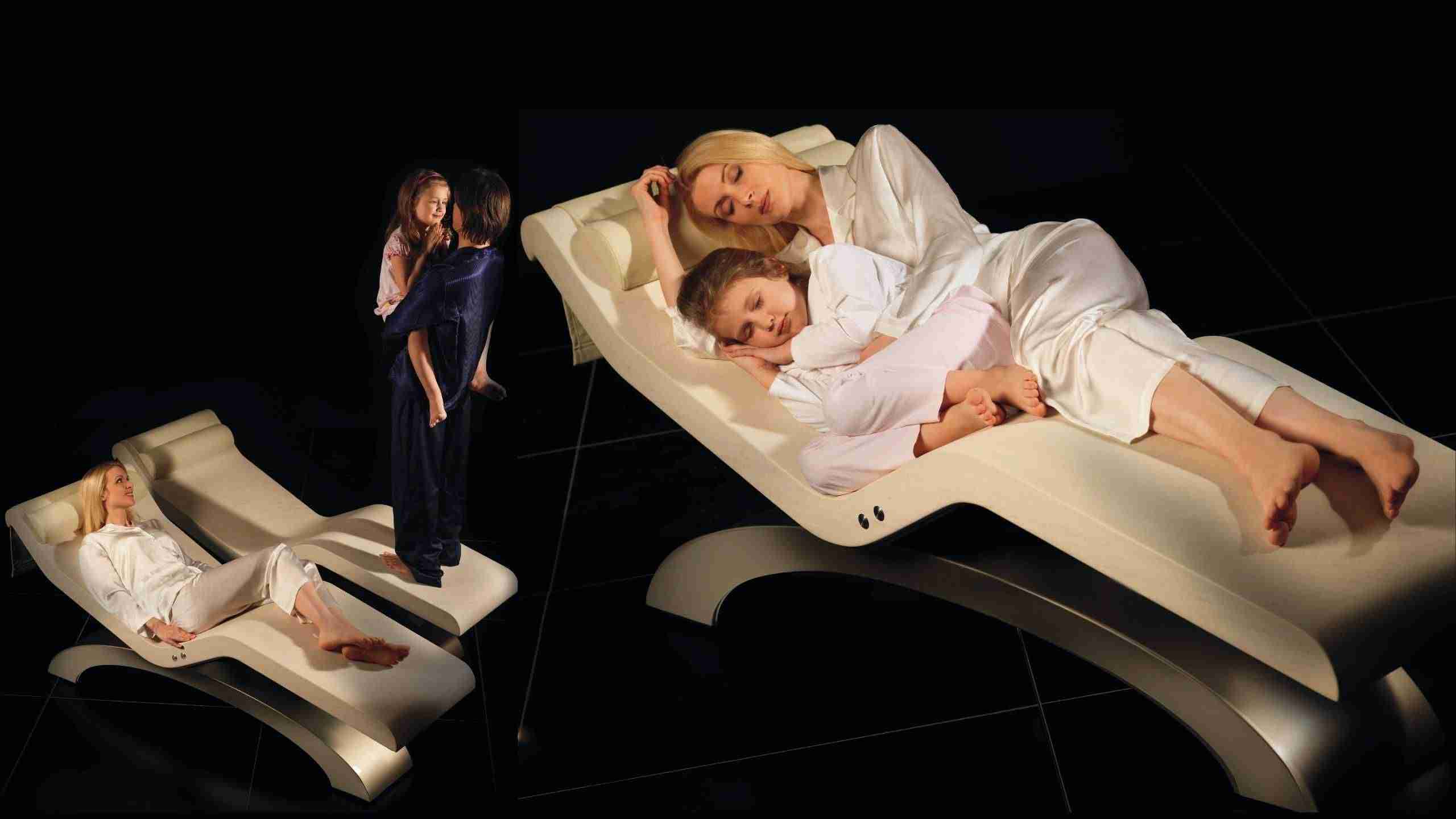 Cleopatra Classico Heated Marble Loungers In Ivory Marble For Family Relaxation.