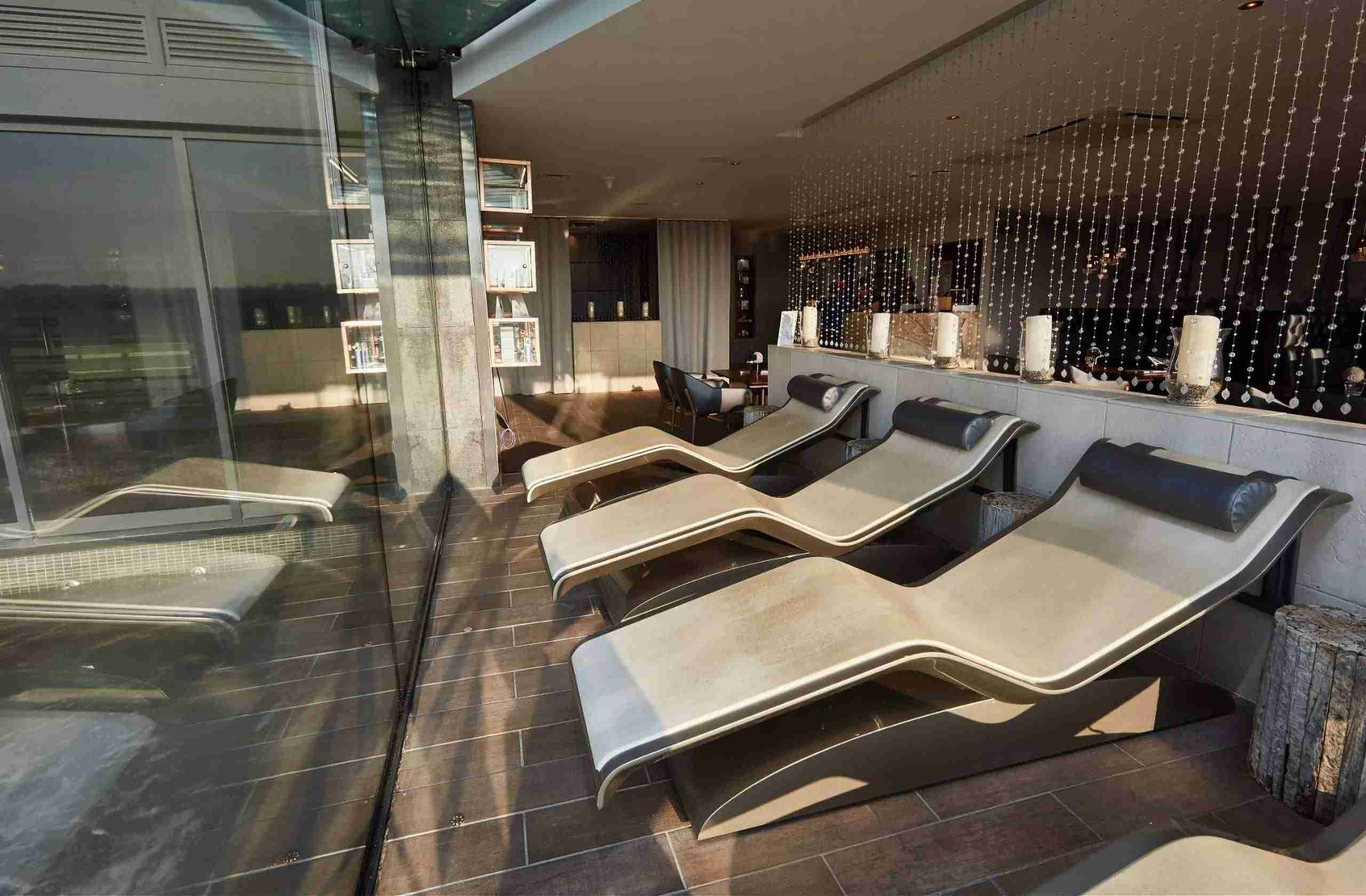 Diva Moderno heated lounger in a luxury spa setting — sculptural wellness lounger for premium relaxation