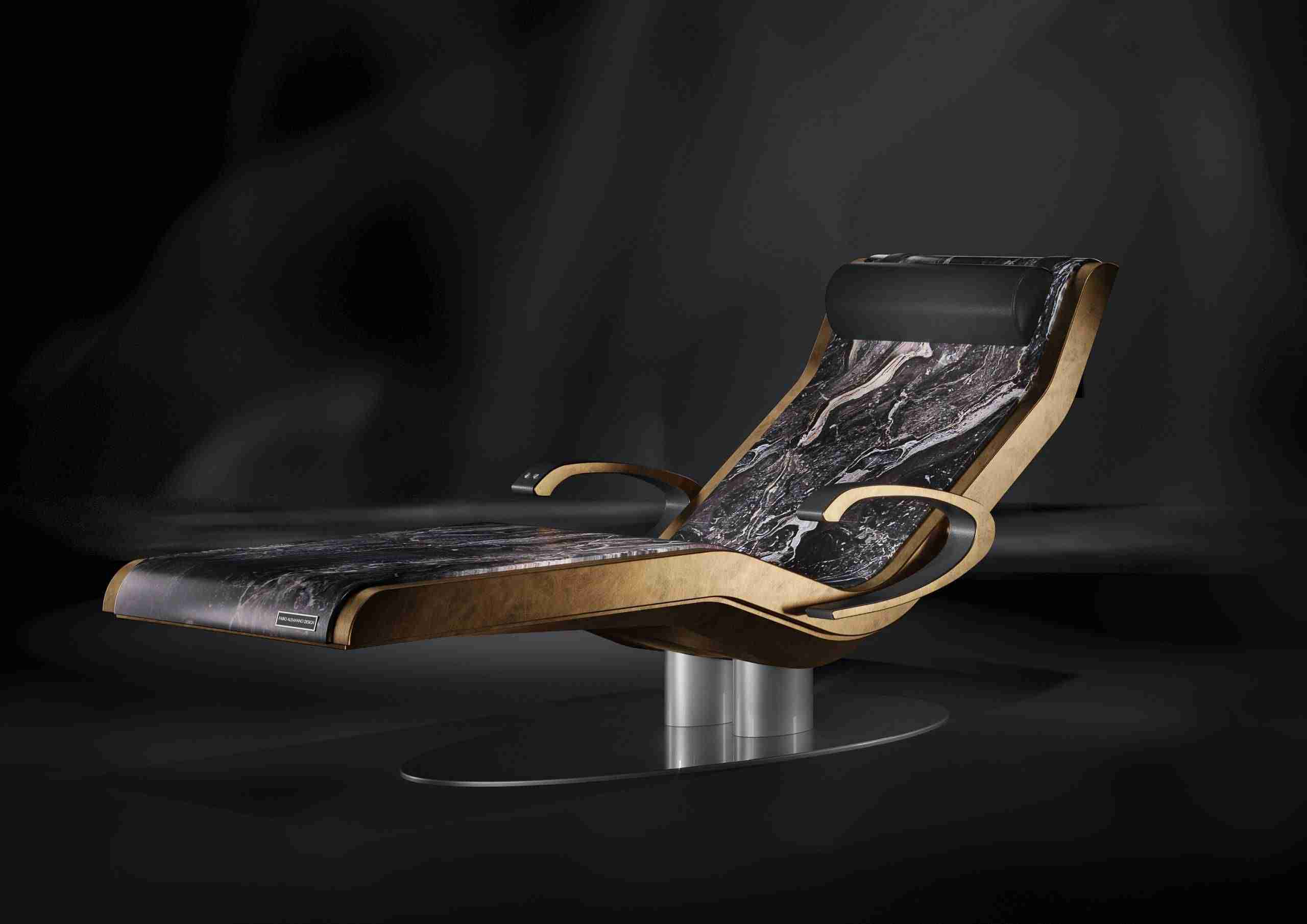 Heated marble chaise longue — Caesar infrared heated lounger in Nero Marquina marble, front view with armrests extended