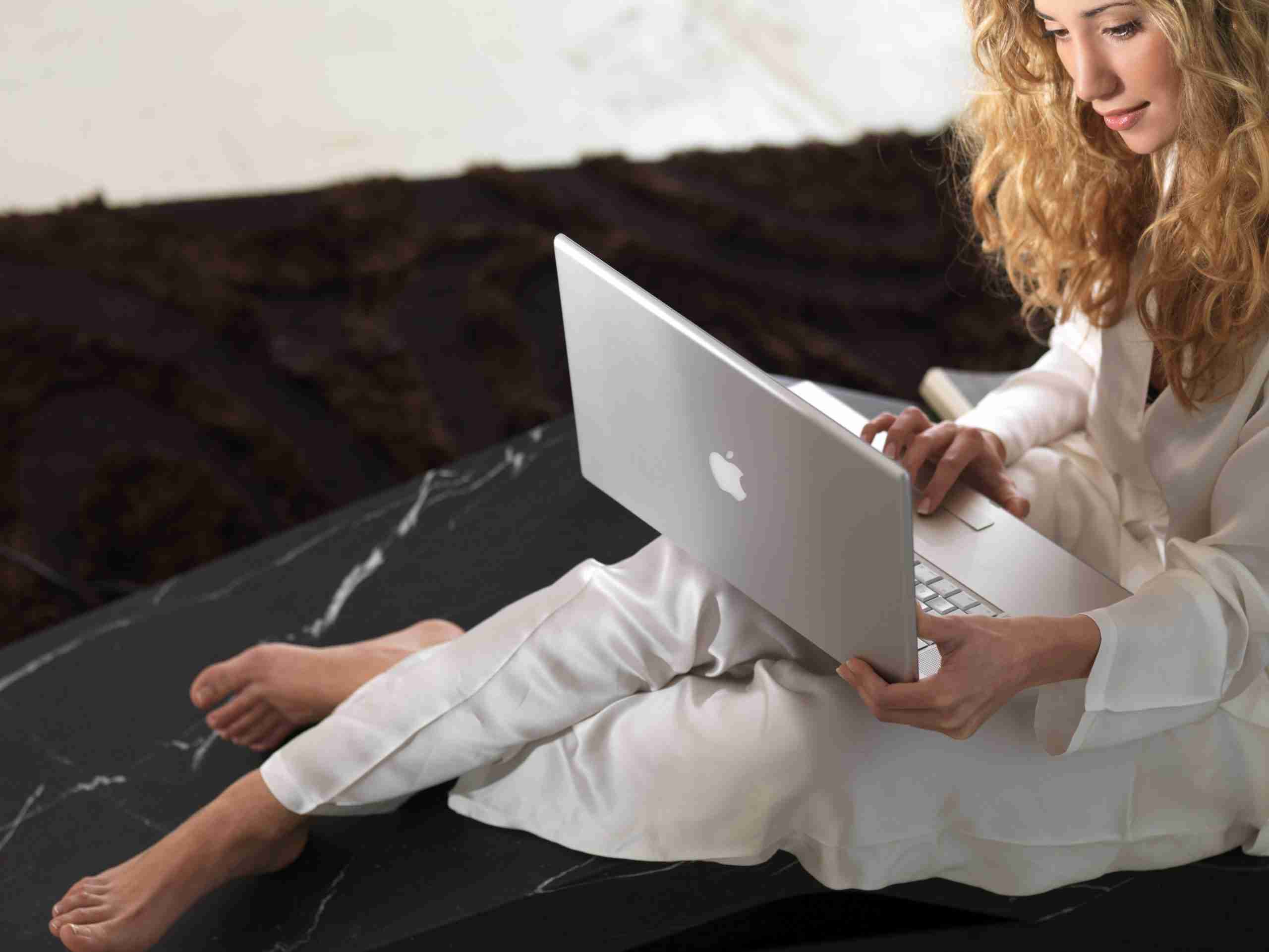 Luxury Home Wellness Suite Featuring Sculptural Heated Marble Loungers Integrated Into Interior Design