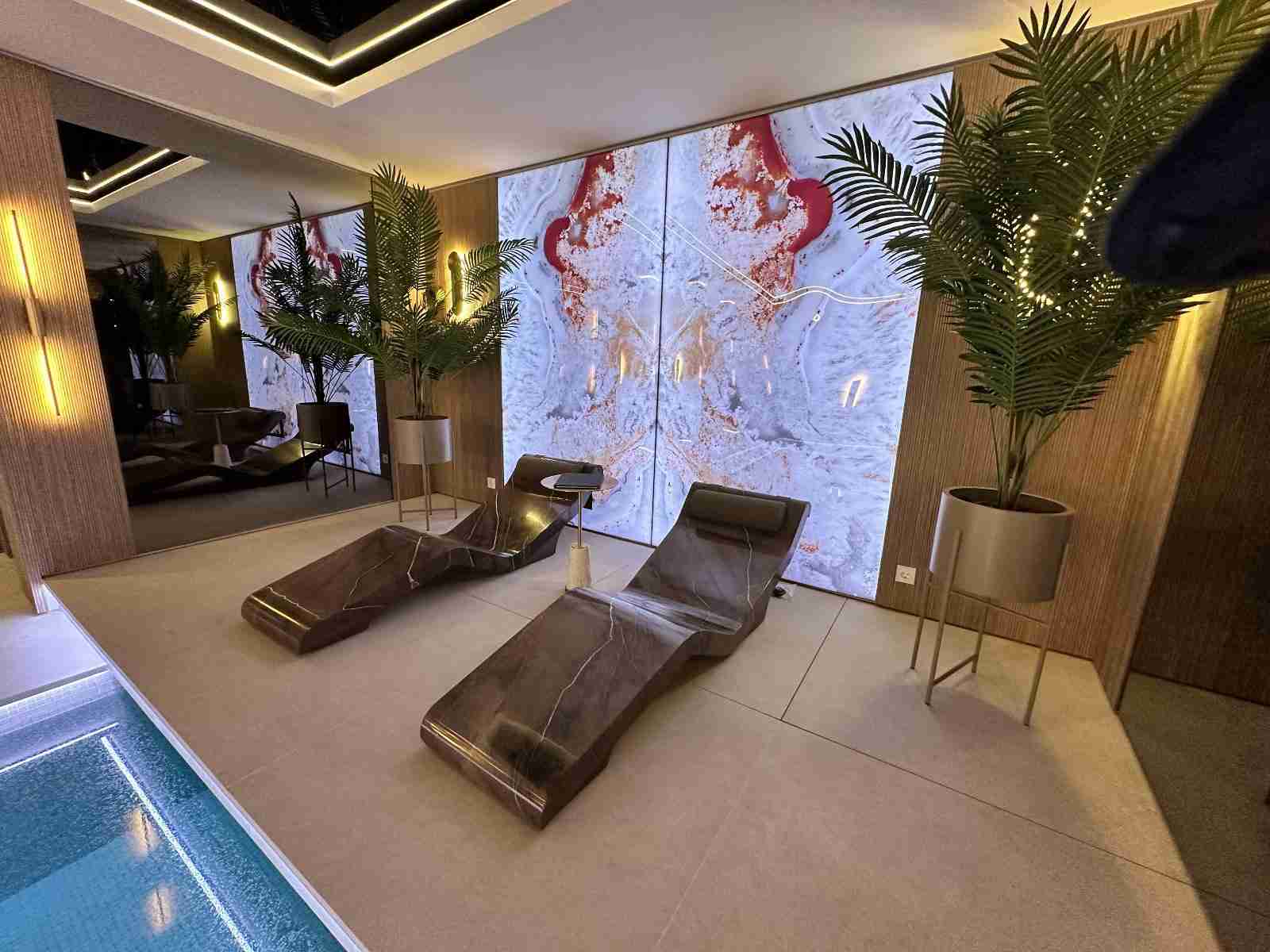 Luxury Spa Furniture Poolside Front View Featuring Cleopatra Basico Infrared Heated Loungers In A Private Club