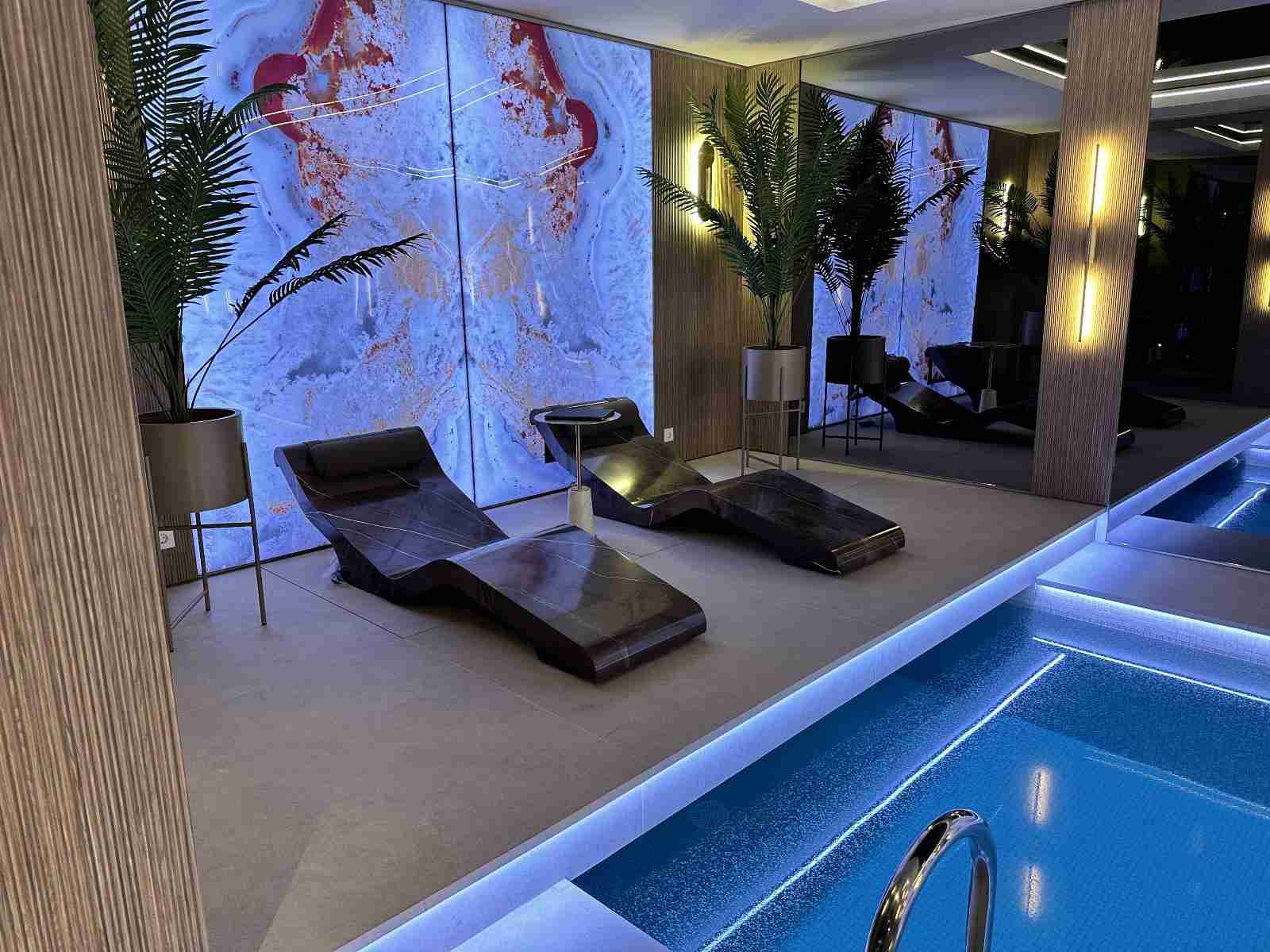 Spa And Wellness Space Poolside At Black Aspen Club Featuring Cleopatra Basico Infrared Heated Loungers