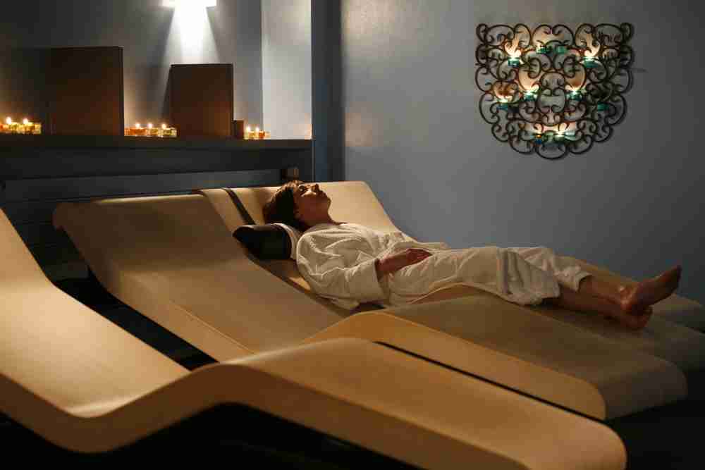 Cleopatra Moderno Heated Marble Loungers In A Luxury Spa Relaxation Area — Soft Lighting And Calm Ambience.
