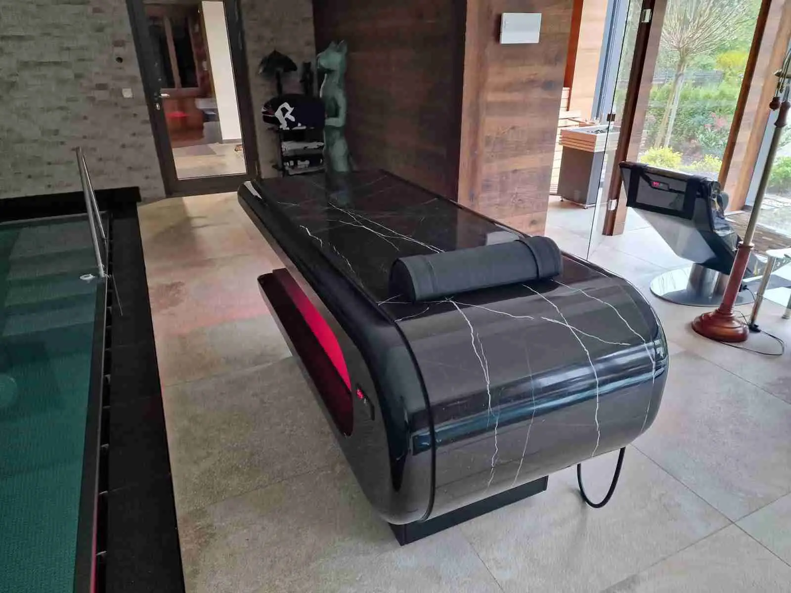 Square Table heated stone table in black finish — private client project with modern aesthetics and warm stone therapy.