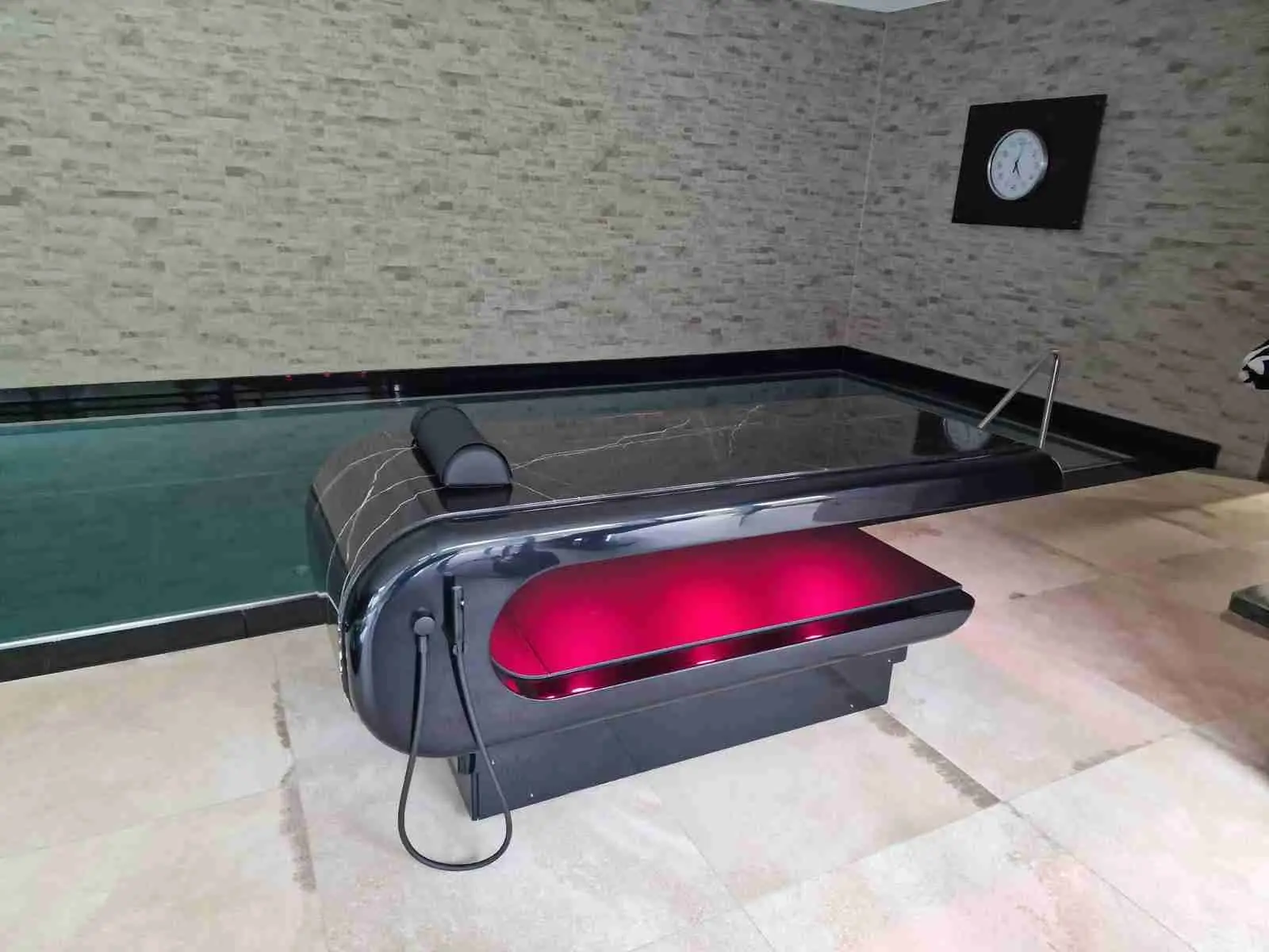 Square Table heated stone massage table — poolside wellness setup for treatments with gentle, even warmth.